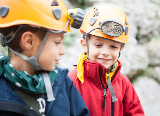 Young,Kids,Wearing,Helmet,For,Cave,Exploration.
