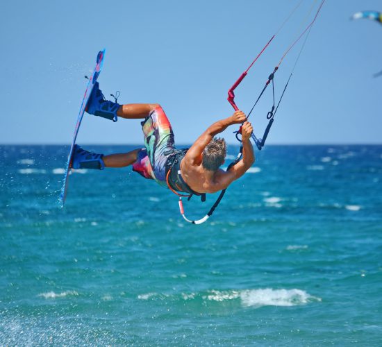 Kiteboarder,Kitesurfer,Athlete,Performing,Kitesurfing,Kiteboarding,Tricks,Unhoocked